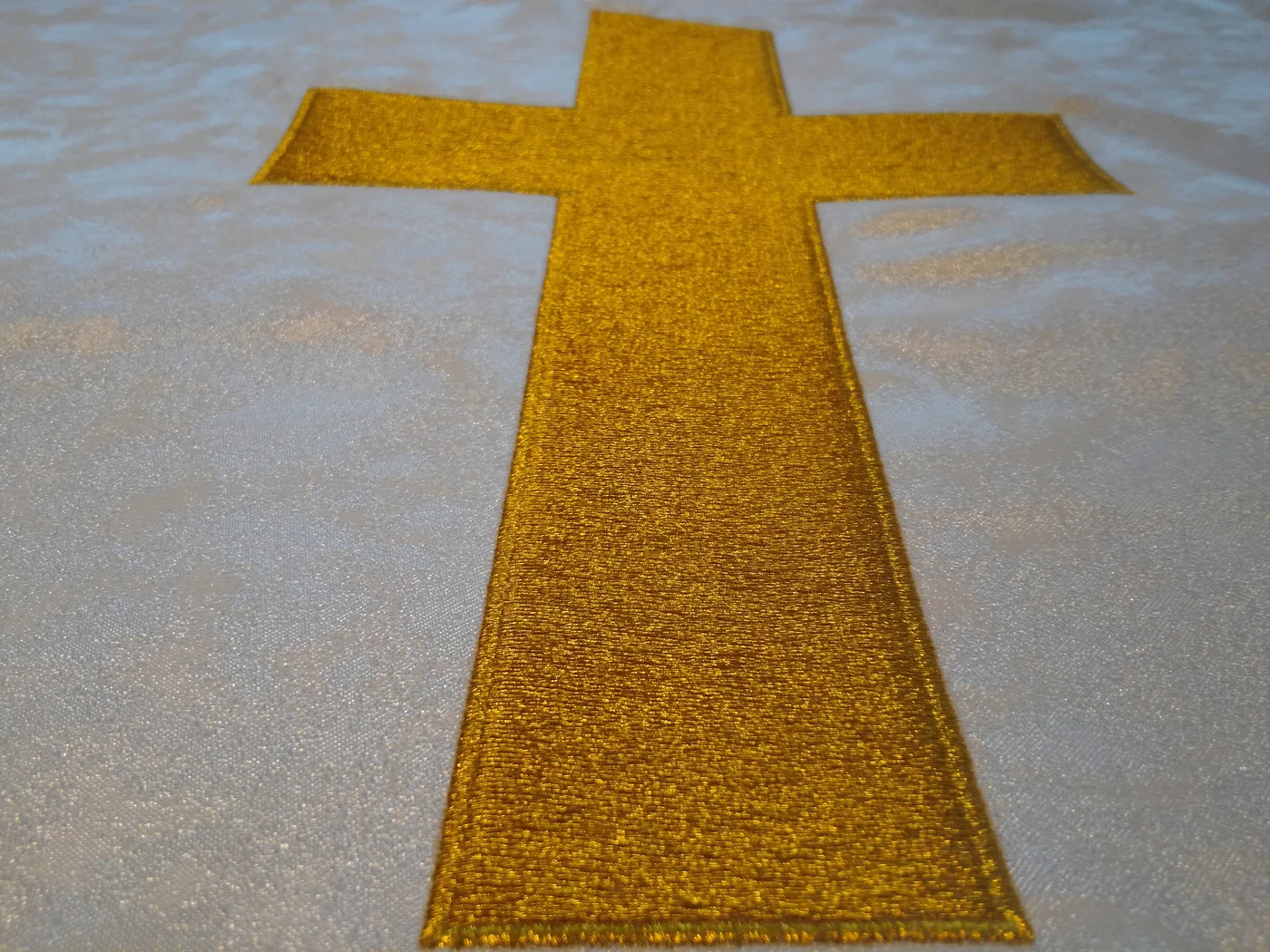 Gold embroidered cross
